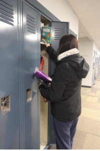 GHS senior gathers essentials when arriving at school well into second period. 